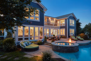 Edgewater waterfront home renovation back exterior with firepit and full rear elevation